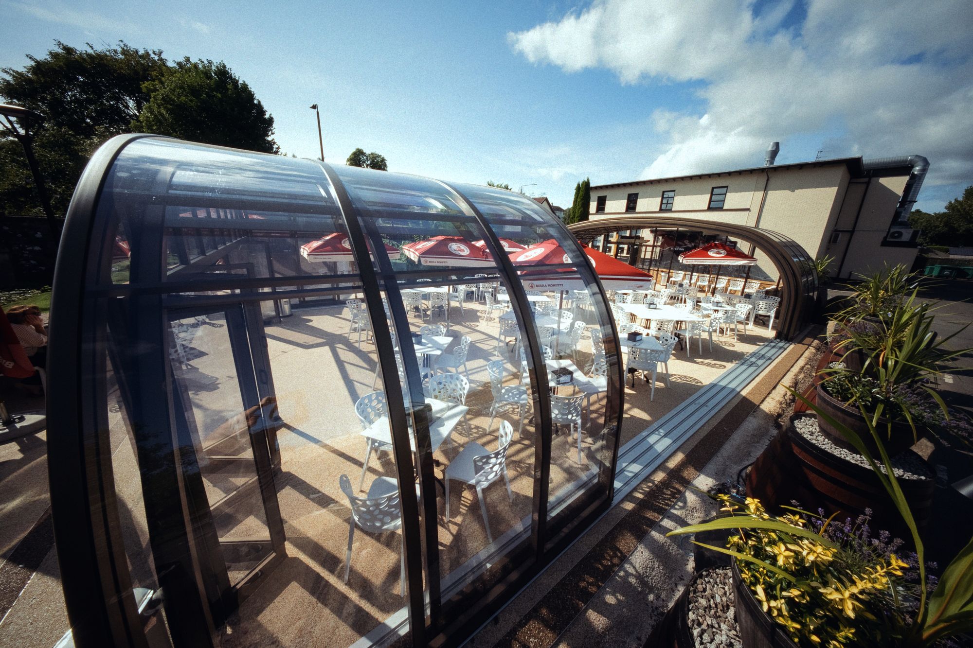 The glasshouse at The River Inn seen from above, filling what was previously open ground