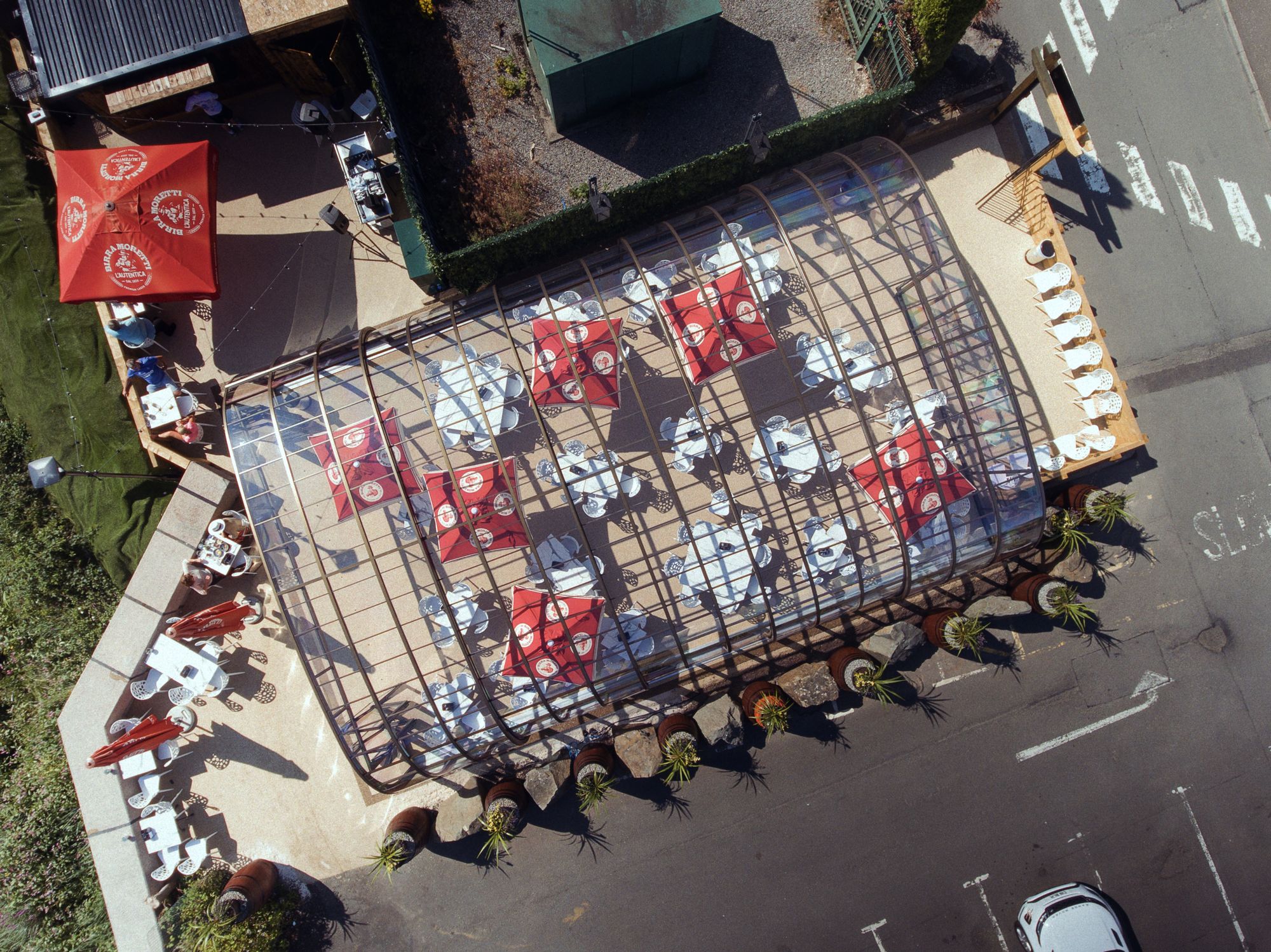 The River Inn glasshouse straight from above, the roof sections and the tables beneath them